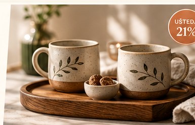 Two handmade-style mugs on a wooden tray